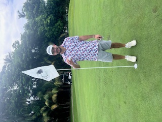 Ethan Blandon teaching golf